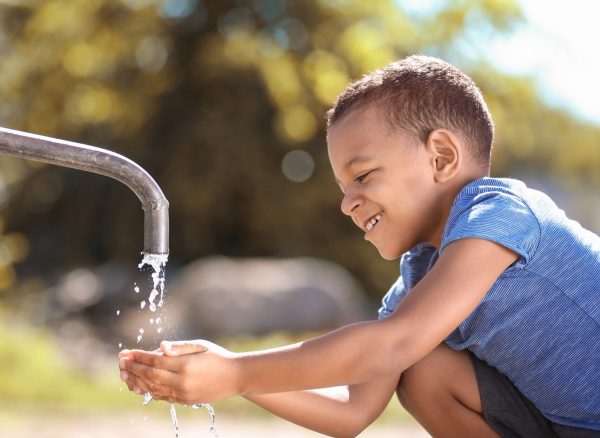 African,American,Child,Drinking,Water,From,Tap,Outdoors.,Water,Scarcity